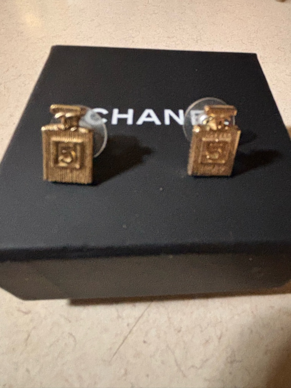 This is an authentic CHANEL Coco No 5 Perfume Bottle Earrings in Gold.